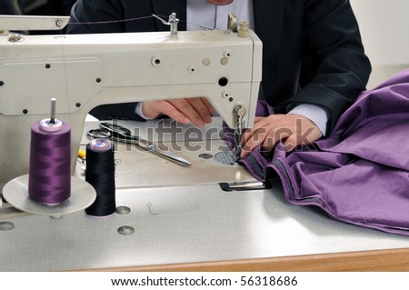 Tailor using industrial sewing machine - a series of TAILOR related images.
