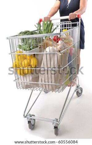 Female shopper with cart isolated on white - a series of SHOPPING TROLLEY images.
