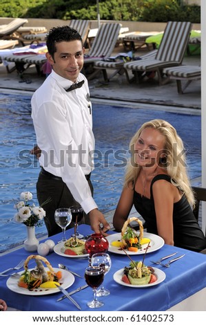 http://image.shutterstock.com/display_pic_with_logo/467524/467524,1285015418,8/stock-photo-attractive-woman-at-a-restaurat-having-dinner-being-served-by-a-waiter-a-series-of-restaurant-61402573.jpg
