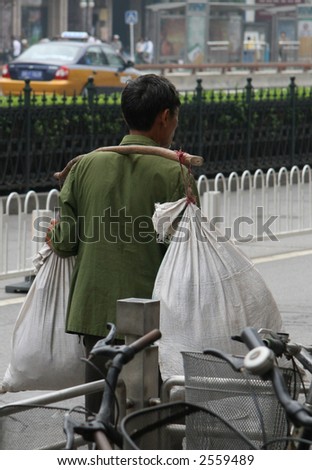 man carrying bags