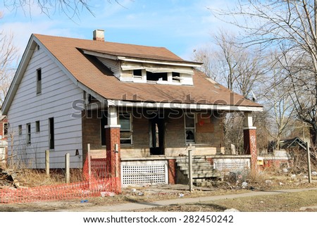 DETROIT, MI-MAY, 2015:  Abandoned and damaged single family home near downtown Detroit.