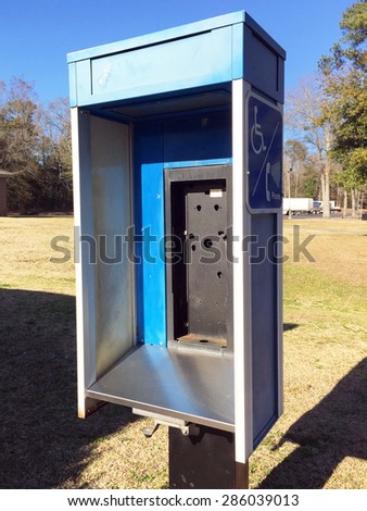 NASHVILLE, TN-MAY, 2015:  Abandoned public telephone booth.  Pay phones are increasingly being removed due to their low usage, having been replaced by cell phones.