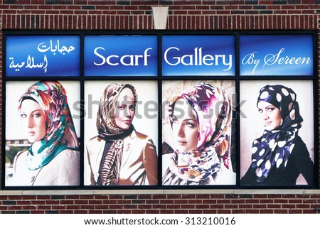 DEARBORN, MI-AUGUST, 2015:  Display window advertising head scarfs in a predominately Arab community near Detroit. Note that the advertising is in arabic script.