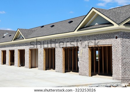 FRANKLIN, TN-OCTOBER, 2015:  9 car garage under construction.  The garages are part of a condominium or townhouse complex in this upscale development.