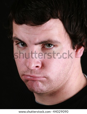 Young Man With A Scowl On His Face Stock Photo 44029090 : Shutterstock