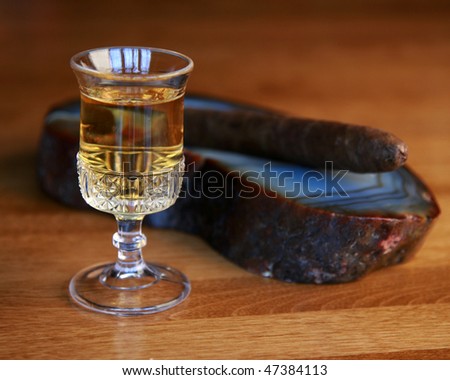 Whiskey, bourbon or scotch and a cigar