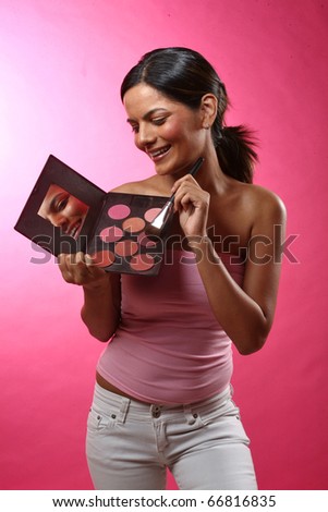 Pretty Woman applying blush makeup