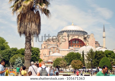 ISTANBUL, TURKEY - JUNE 03: Tourists near Hagia Sophia on the Trinity Sunday on June 03, 2012 in Istanbul, Turkey. Hagia Sophia is a former Orthodox basilica, later a mosque, and now a museum.