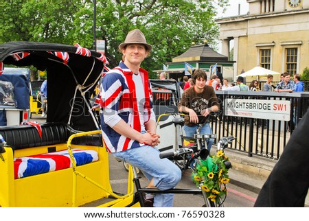 LONDON, ENGLAND - APRIL 29: Cab driver wearing T-shirt with flag of UK near Buckingham Palace on the day of the wedding of Prince William on April 29, 2011 in London England