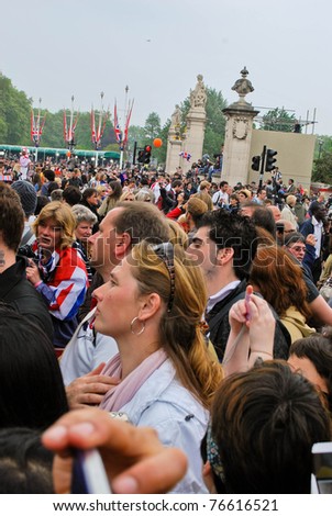 LONDON, UK - APRIL 29: The crowd waiting for the first kiss of the royal couple on the Mall near the Buckingham Palace, April 29, 2011 in London, United Kingdom