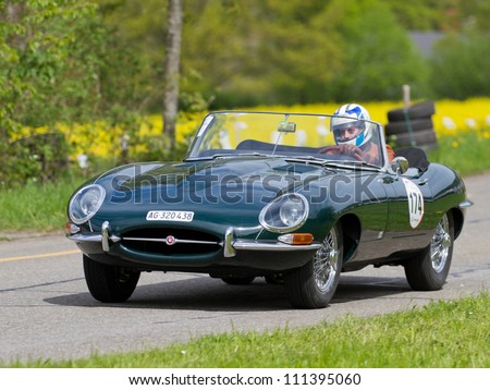 MUTSCHELLEN, SWITZERLAND-APRIL 29: Vintage race touring car Jaguar E-Type from 1963 at Grand Prix in Mutschellen, SUI on April 29, 2012.  Invited were vintage sports cars and motorbikes.