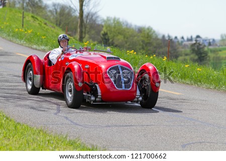 MUTSCHELLEN, SWITZERLAND-APRIL 29: Vintage race touring car Healey Silverstone Typ E from 1950 at Grand Prix in Mutschellen, SUI on April 29, 2012.  Invited were vintage sports cars and motorbikes.