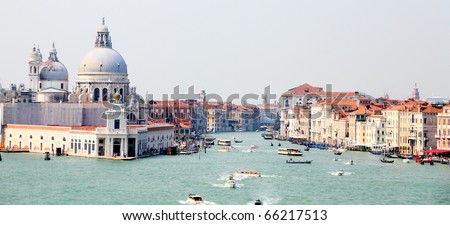 UNESCO World heritage city Venice, Italy at the entrance to canal Grande with old houses, church Santa Maria del Salute,channels and ferries