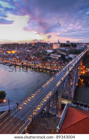 Lighted  famous bridge Ponte dom Luis above  Old town Porto at river Duoro at night, Portugal