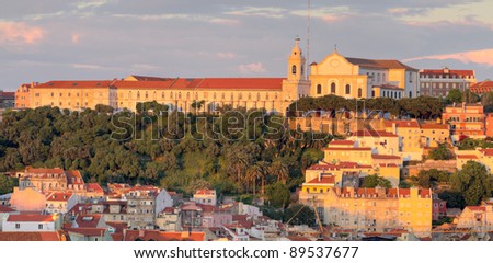 historic mediterranean architecture with large church at sunset in Lisboa, Portugal