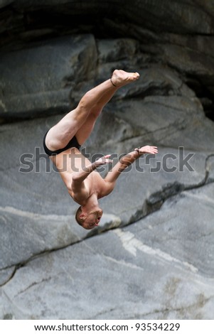 LOCARNO - JULY 23: Cliff diving athlete Christian Guth competes in the WHDF European Championship 2011 with dives from up to 20m high at Ponte Brolla July 23, 2011 in Locarno, Switzerland.