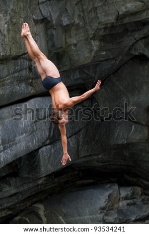 LOCARNO - JULY 23: Cliff diving athlete Christian Guth competes in the WHDF European Championship 2011 with dives from up to 20m high at Ponte Brolla July 23, 2011 in Locarno, Switzerland.