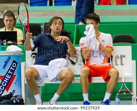 ZURICH, SWITZERLAND-MARCH 24: Henri Leconte (l.) gives advice to Julien Cagnina in double final of BNP Paribas Open Champions Tour in Zurich, SUI on March 24, 2012.  Duo Henman, Edwards won the title.