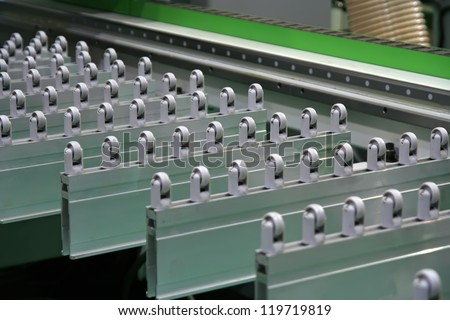 Conveyer belt. Factory track. Wood cutting machine. Woodworking machine. Conveyor belt.