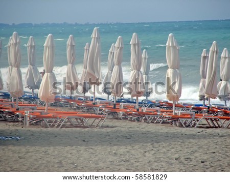 beach cafe. umbrellas and sunbeds on the beach.