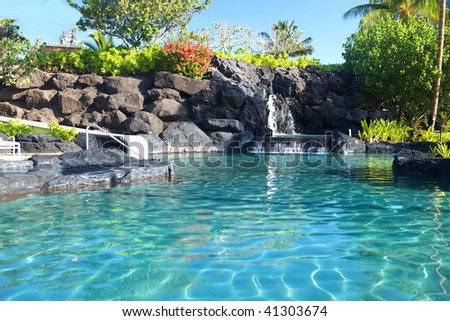 Tropical waterfall landscape in a beautiful relaxing spa resort, copy space