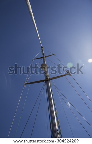 Nautical part of a yacht with cords, rigging, sail, mast, anchor, knots