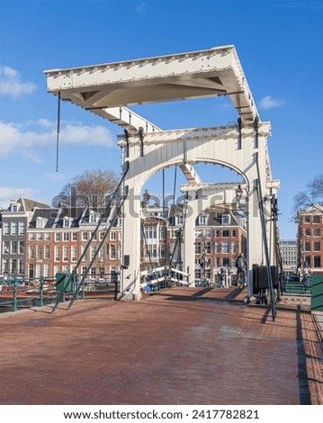 Similar – Image, Stock Photo Bridge over the Amstel river at night in Amsterdam