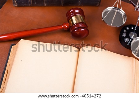 Blank Old Book and law concept on leather desktop