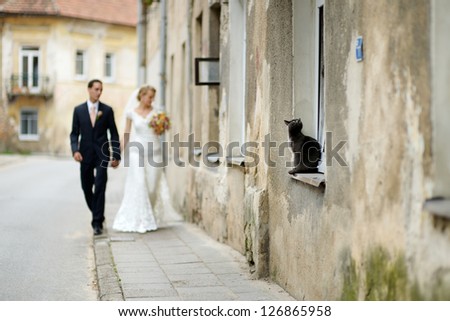 Happy bride and groom taking a walk together