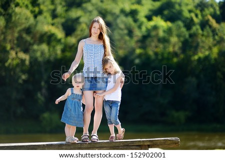 Young mother and her two little daughters