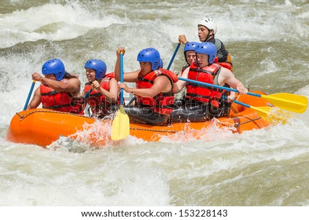 White water rafting team in bright sunlight, Pastaza river, Ecuador, Sangay National Park.