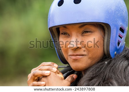 CLOSE UP OF AFRO LADY WEARING PROTECTIVE SPORT HELMET