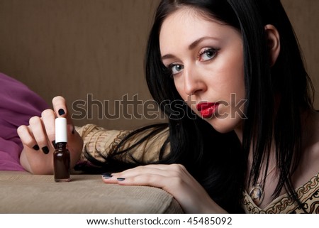 BEAUTIFUL WOMAN SHOWING NAIL POLISH THAT SHE USES FREQUENTLY