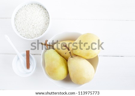 Ingredients for a rice pudding dessert: pears, rice pudding, sugar.
