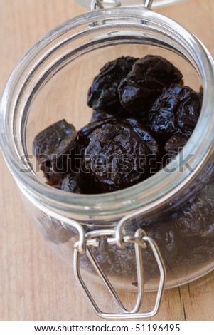 Selective focus image of dried prunes which are often in cereal products like muesli.