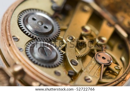 Full frame image of the clockwork of a pocket watch.