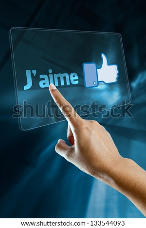 a woman finger select and like  on a french language digital screen