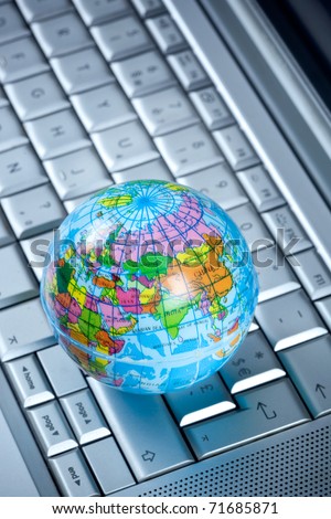 a globe on a computer keyboard