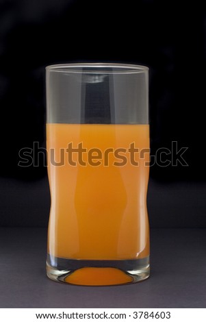 Tall glass holding orange juice isolated on white background