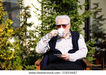 old man drinking coffee