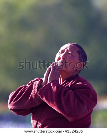 LHASA - JUNE 30: An old female buddhist prays in Tibetan Shoton festival June 30, 2009 in  Lhasa city, Tibet of China.