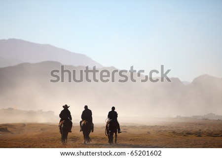 Similar – Image, Stock Photo The three riders and their dogs return after work