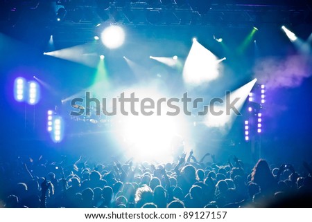 Stage lights A pop rock concert scene with crowd in the foreground