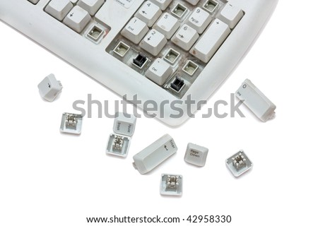 Old broken keyboard with scattered keys. Isolated on white background.