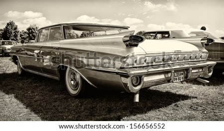 PAAREN IM GLIEN, GERMANY - MAY 19: Full-size car Oldsmobile 98 (Fifth generation), rear view, sepia, \