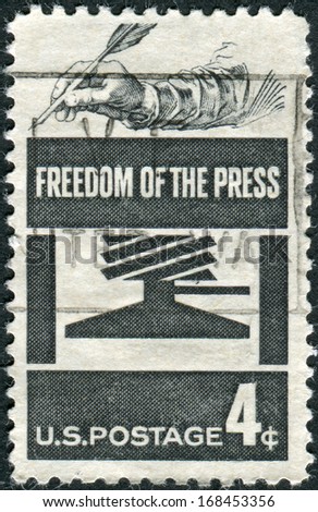 USA - CIRCA 1958: Postage stamp printed in USA, Freedom of Press Issue, shows Early Press and Hand Holding Quill, circa 1958