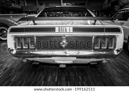 BERLIN, GERMANY - MAY 17, 2014: Ford Mustang Mach 1, Ramair Cobra Jet - is an performance-oriented option package of the Ford Mustang. Black - white. Rear view. 27th Oldtimer Day Berlin - Brandenburg