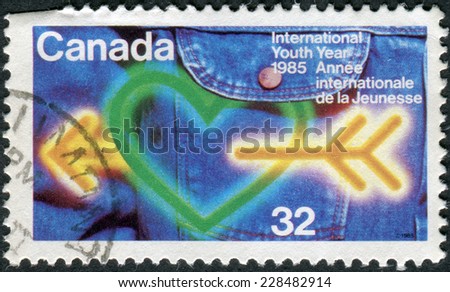 CANADA - CIRCA 1985: Postage stamp printed in Canada, dedicated to International Youth Year, shows the Heart, arrow, jeans, circa 1985