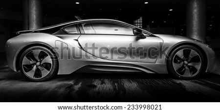 BERLIN - NOVEMBER 28, 2014: Showroom. The BMW i8, first introduced as the BMW Concept Vision Efficient Dynamics, is a plug-in hybrid sports car developed by BMW. Black and white.