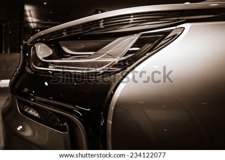 BERLIN - NOVEMBER 28, 2014: Showroom. The rear lights of the car BMW i8, first introduced as the BMW Concept Vision Efficient Dynamics, is a plug-in hybrid sports car developed by BMW. Toning